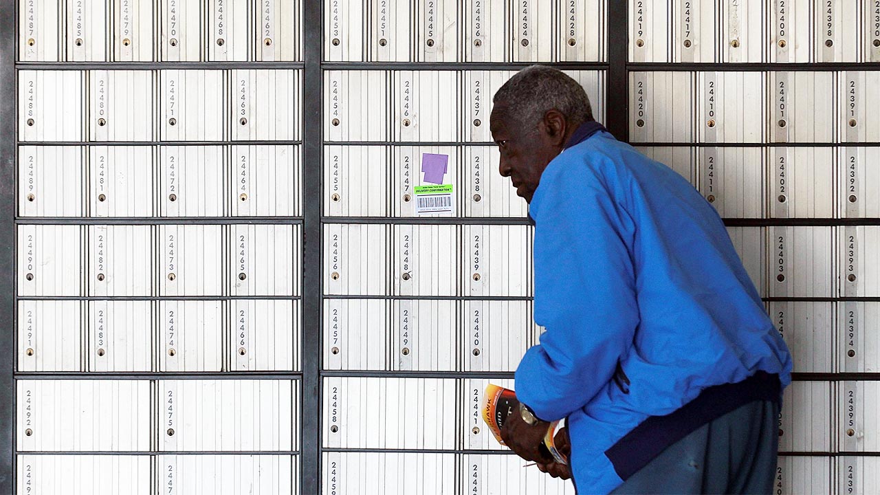 Postal customer looking for his P.O. box