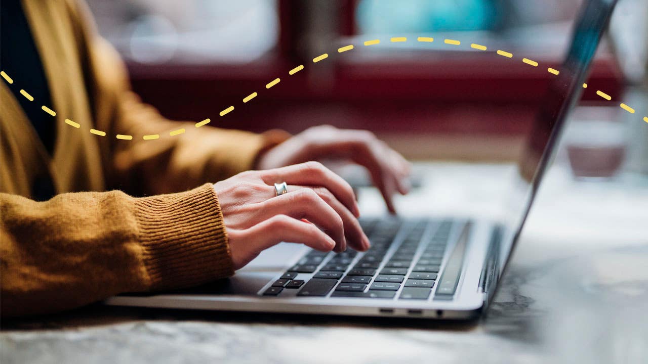 woman typing on a laptop