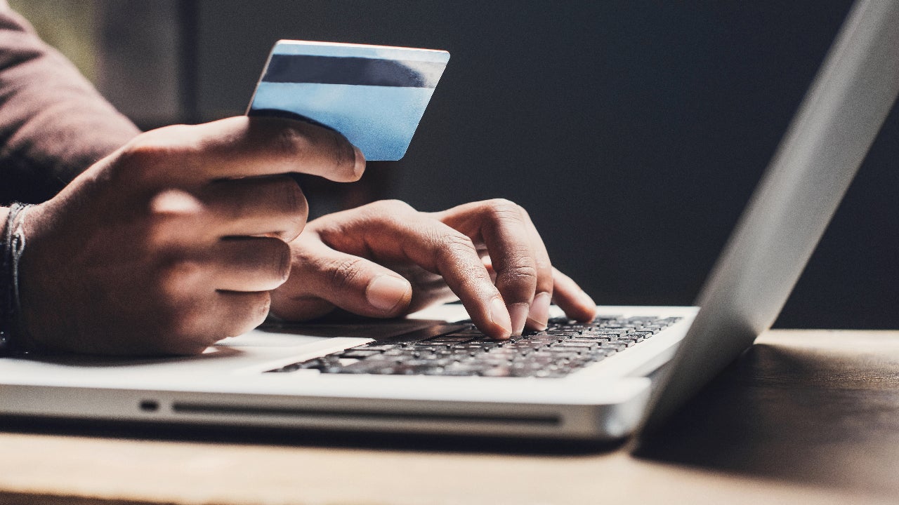Person holding credit card