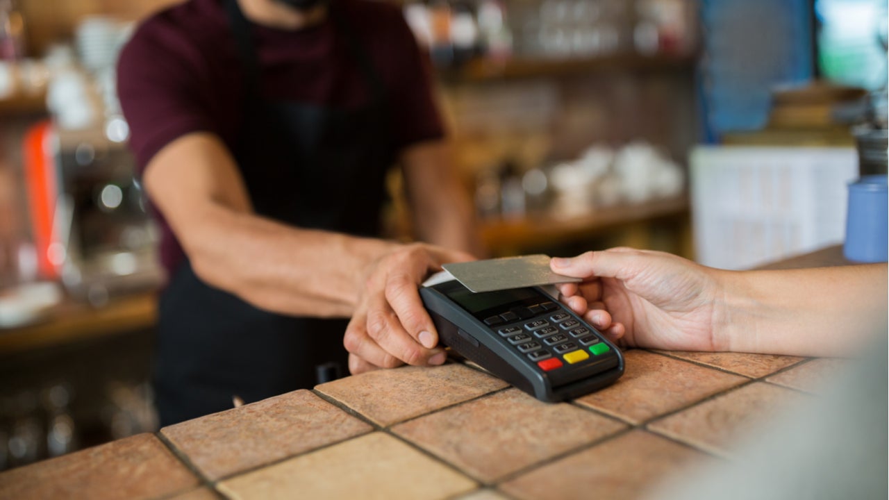 man paying with card