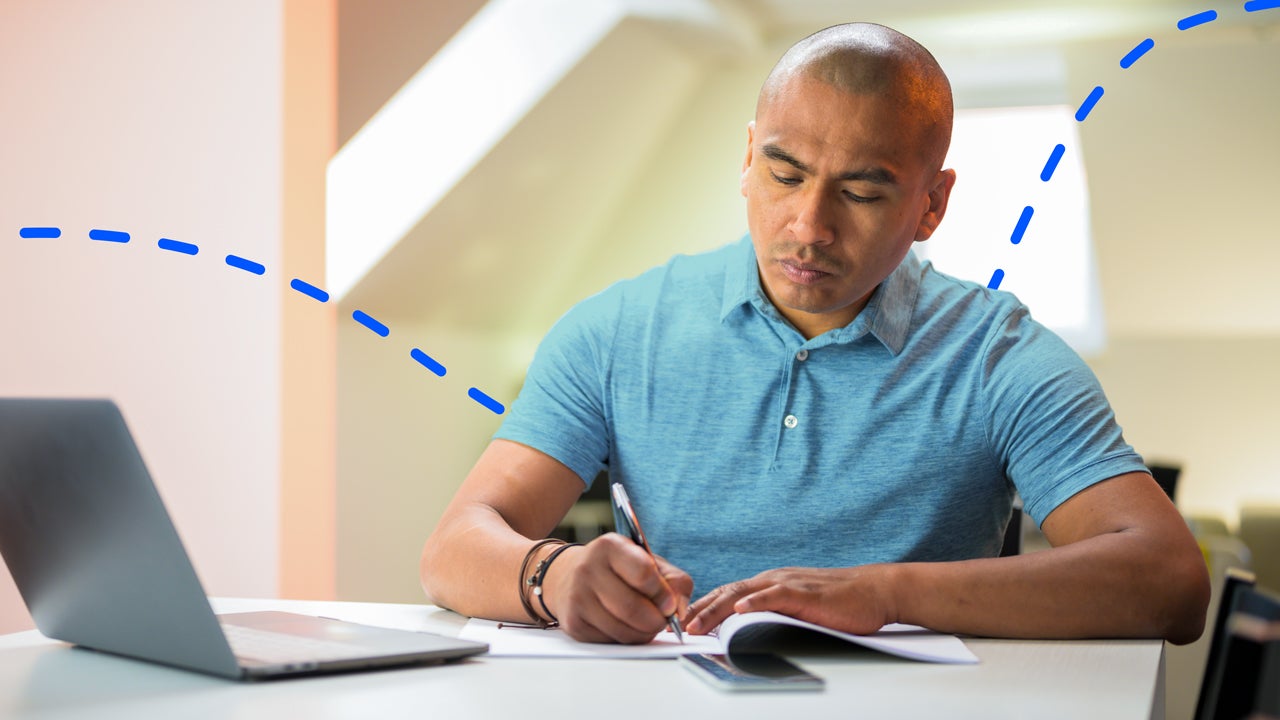 Person writing on a piece of paper