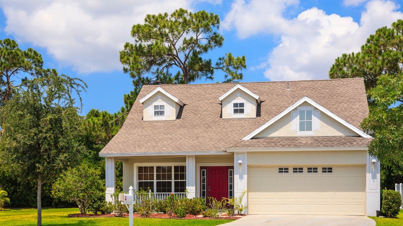 A small cottage-style home with attached garage