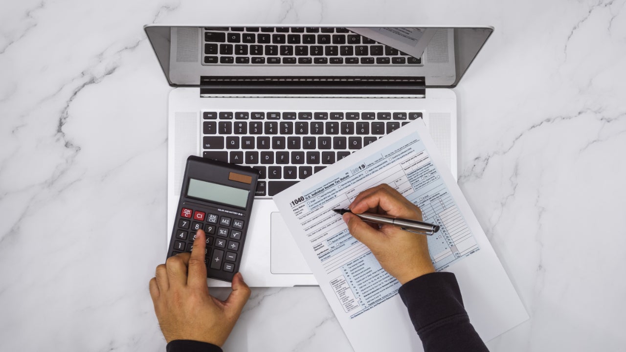 Hands doing taxes