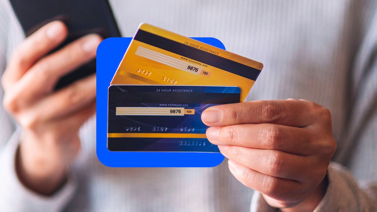 hand holding two credit cards
