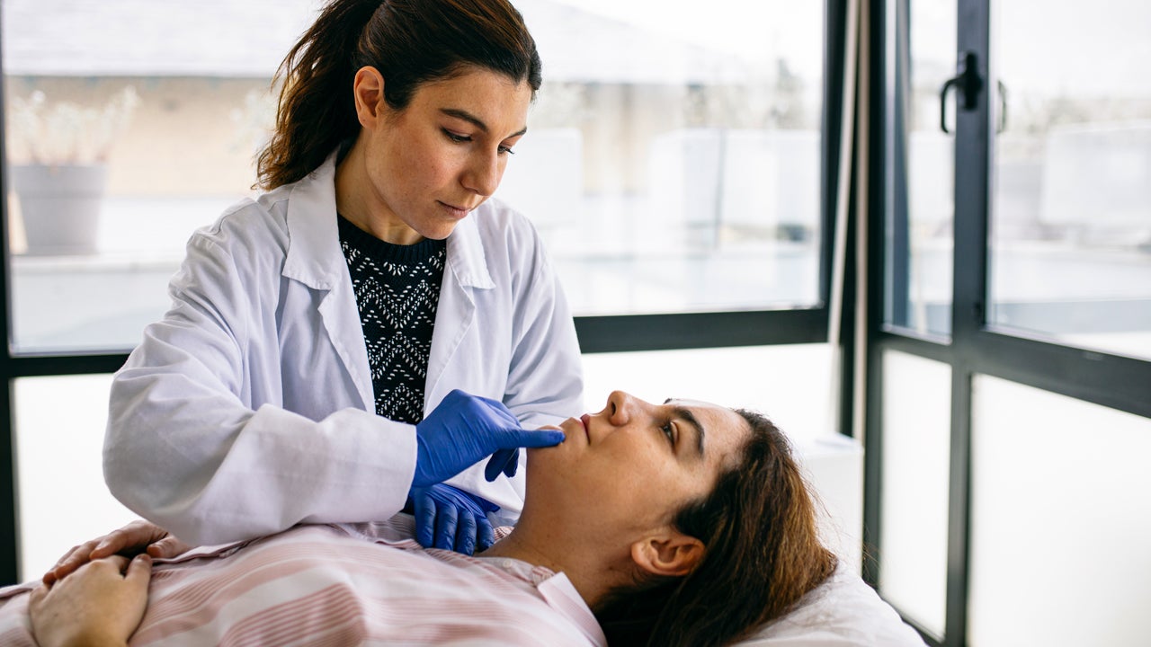 woman receiving a beauty treatment in a medical office