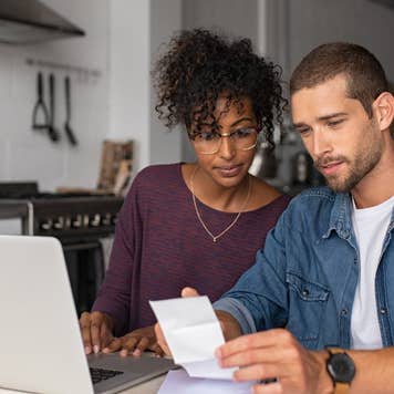 Couple reviewing bills, managing finances