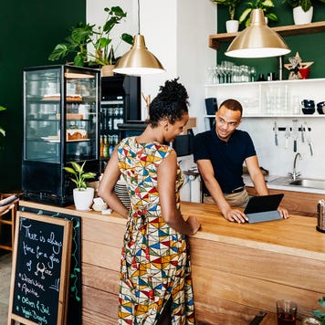 young person at counter checking out at a restaurant