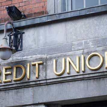 Credit sign on stone wall building