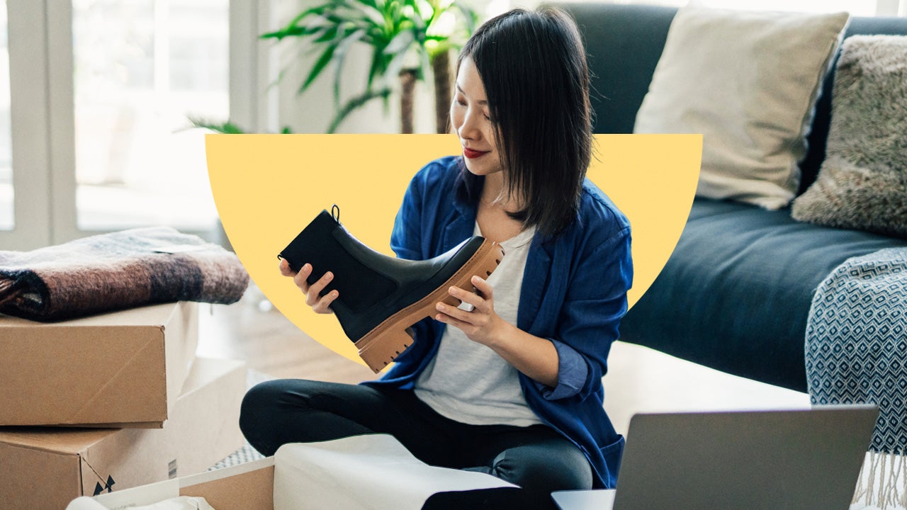 design element of a women sitting on a couch in a living room holding a boot