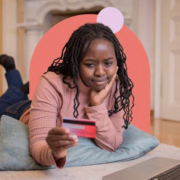 design element including a young adult laying down and holding a card in their hand