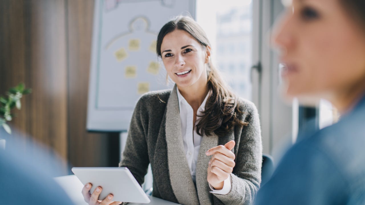 Financial advisor talking to clients