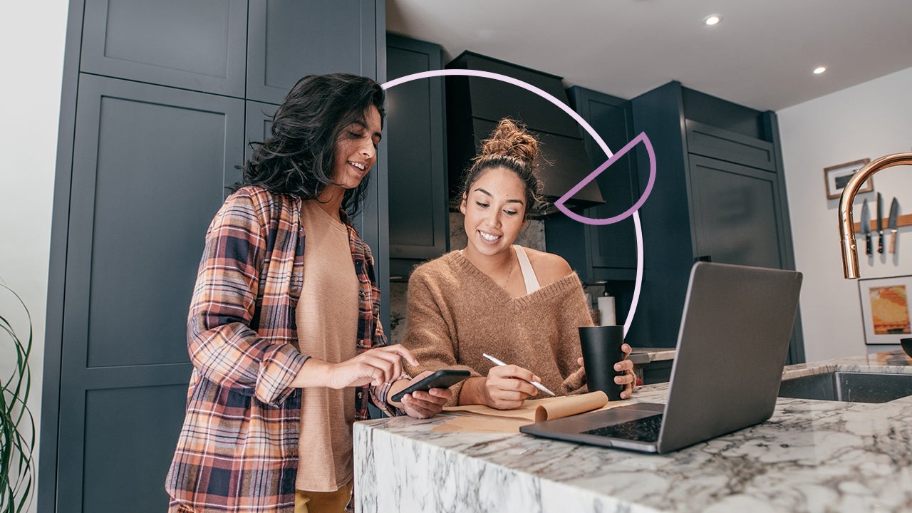 two women looking to buy a house online