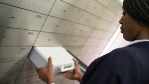 Person taking safety deposit box out