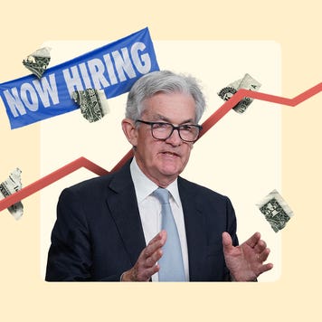 Jerome Powell speaking. A now hiring banner in the background.