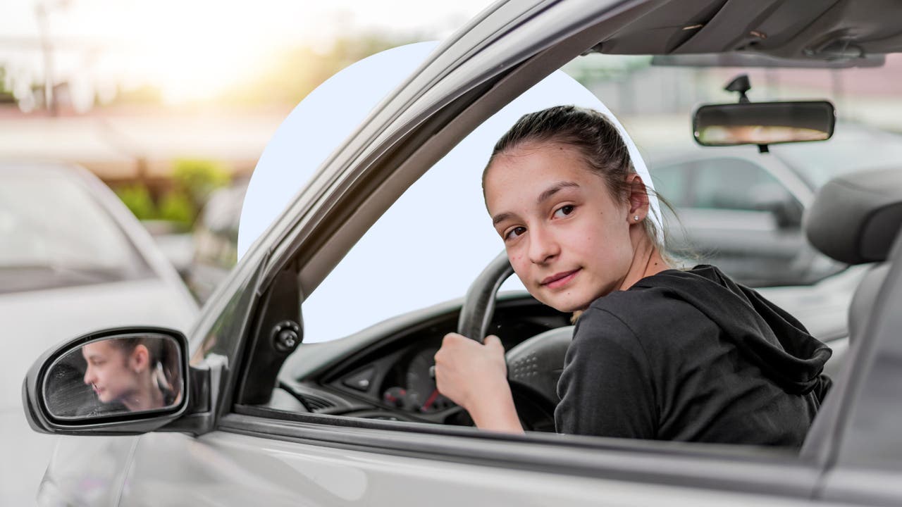 Person driving a car and looking back as they back up