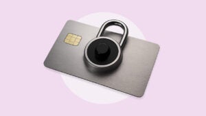A grey credit card with a dial lock on it.