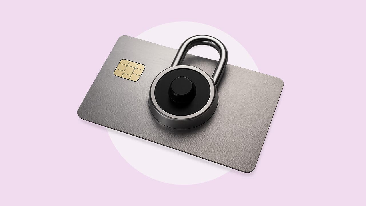 A grey credit card with a dial lock on it.
