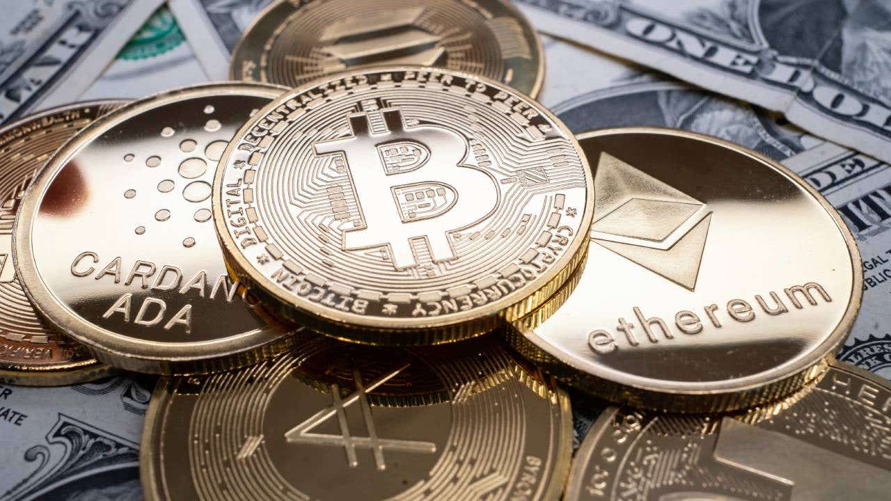 Various crypto tokens stacked on top of cash.