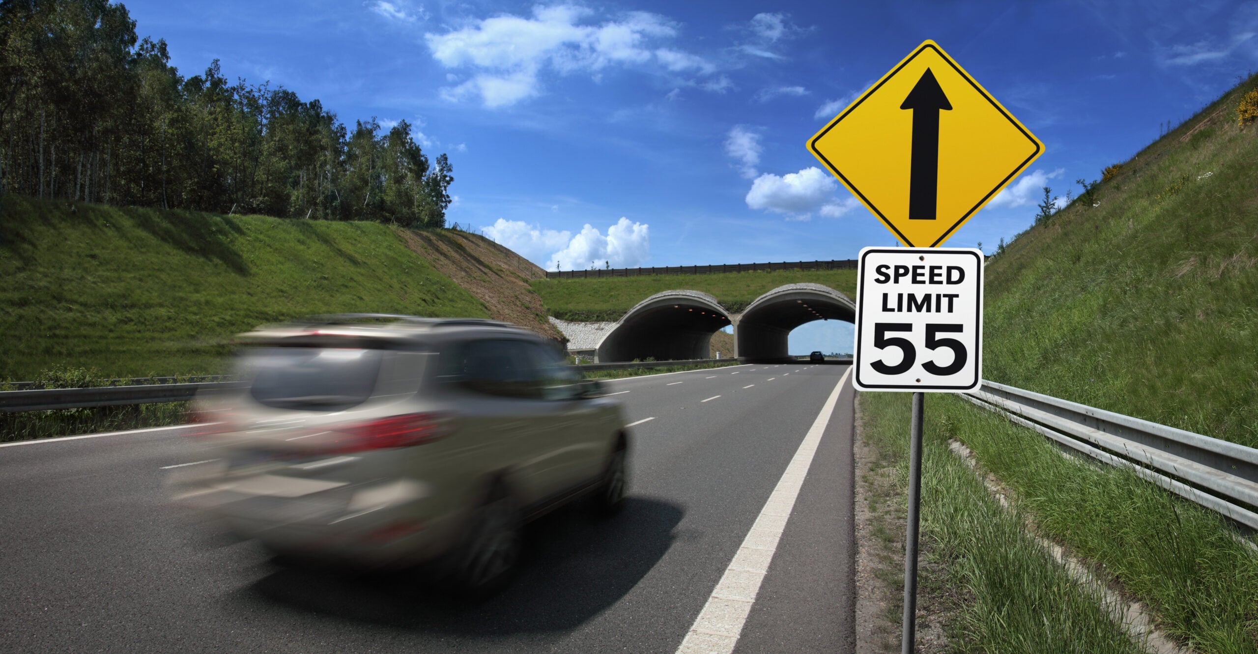 car driving over the 55 mph speed limit