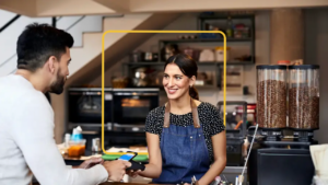 Woman and man in a shop doing business