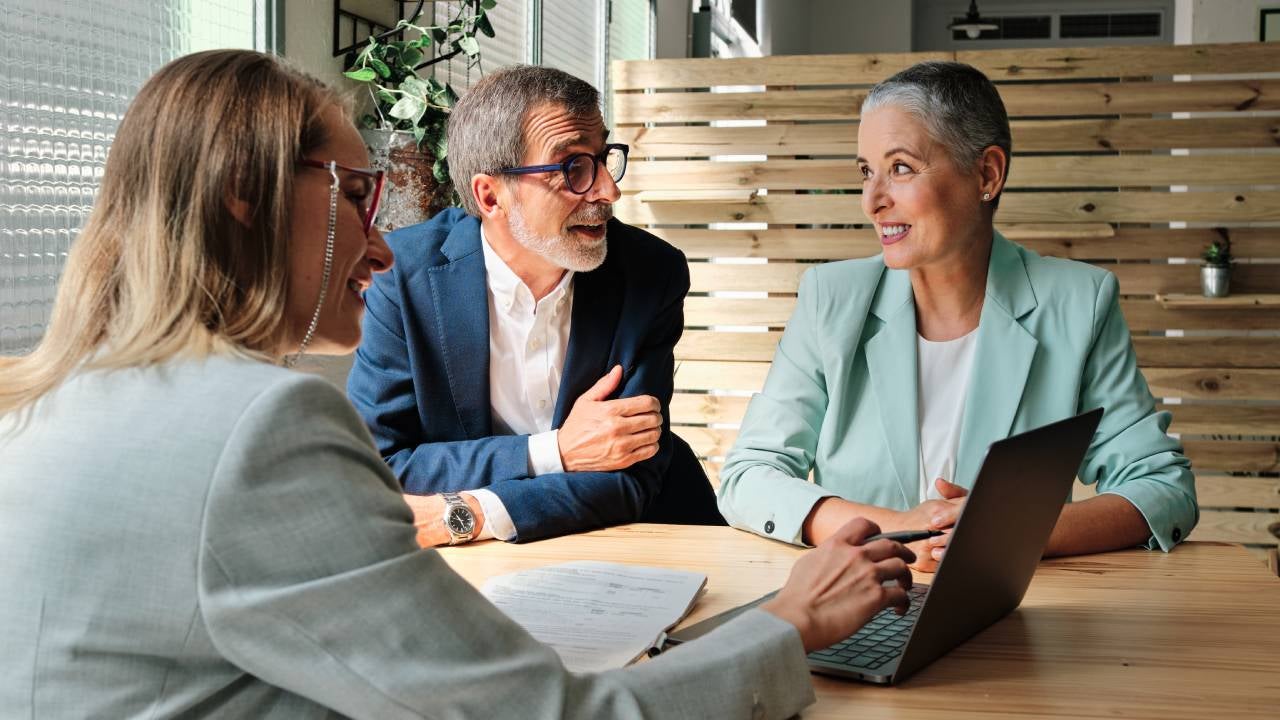 Couple meeting with a financial advisor.