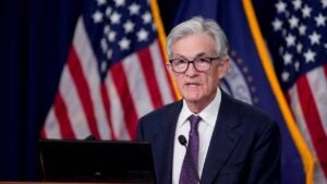 Federal Reserve Chair Jerome Powell speaking behind a podium.