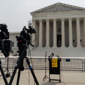 Video cameras point at an empty podium outside the US Supreme Court