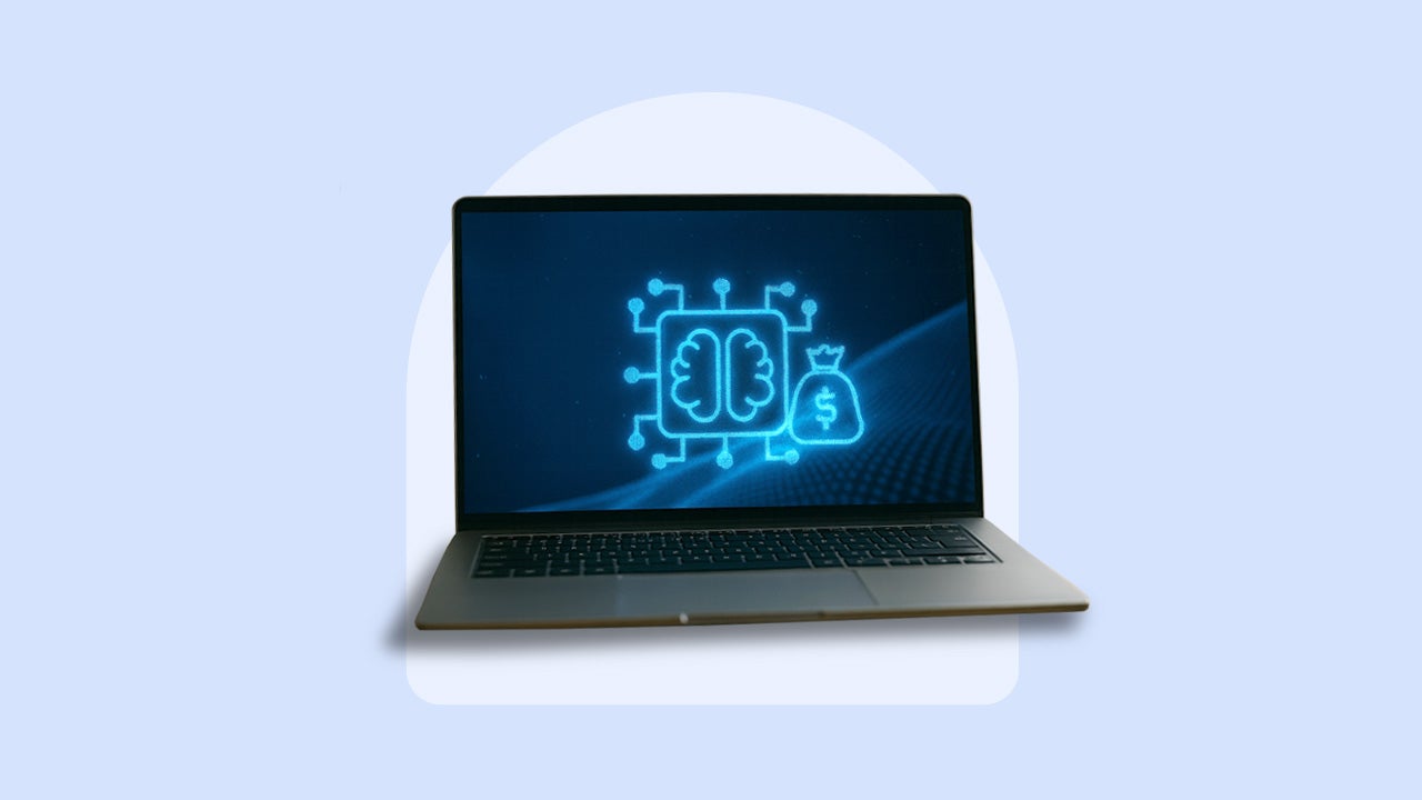 A computer with AI imagery including a brain and bag of cash is seen