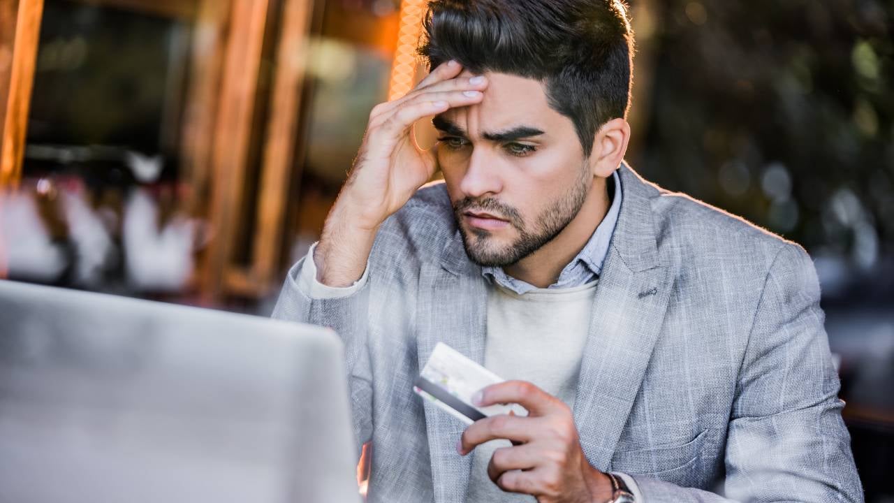 Young man having more expenses than expected.