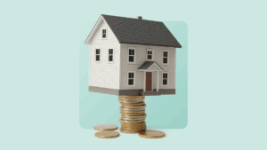House standing on stack of coins