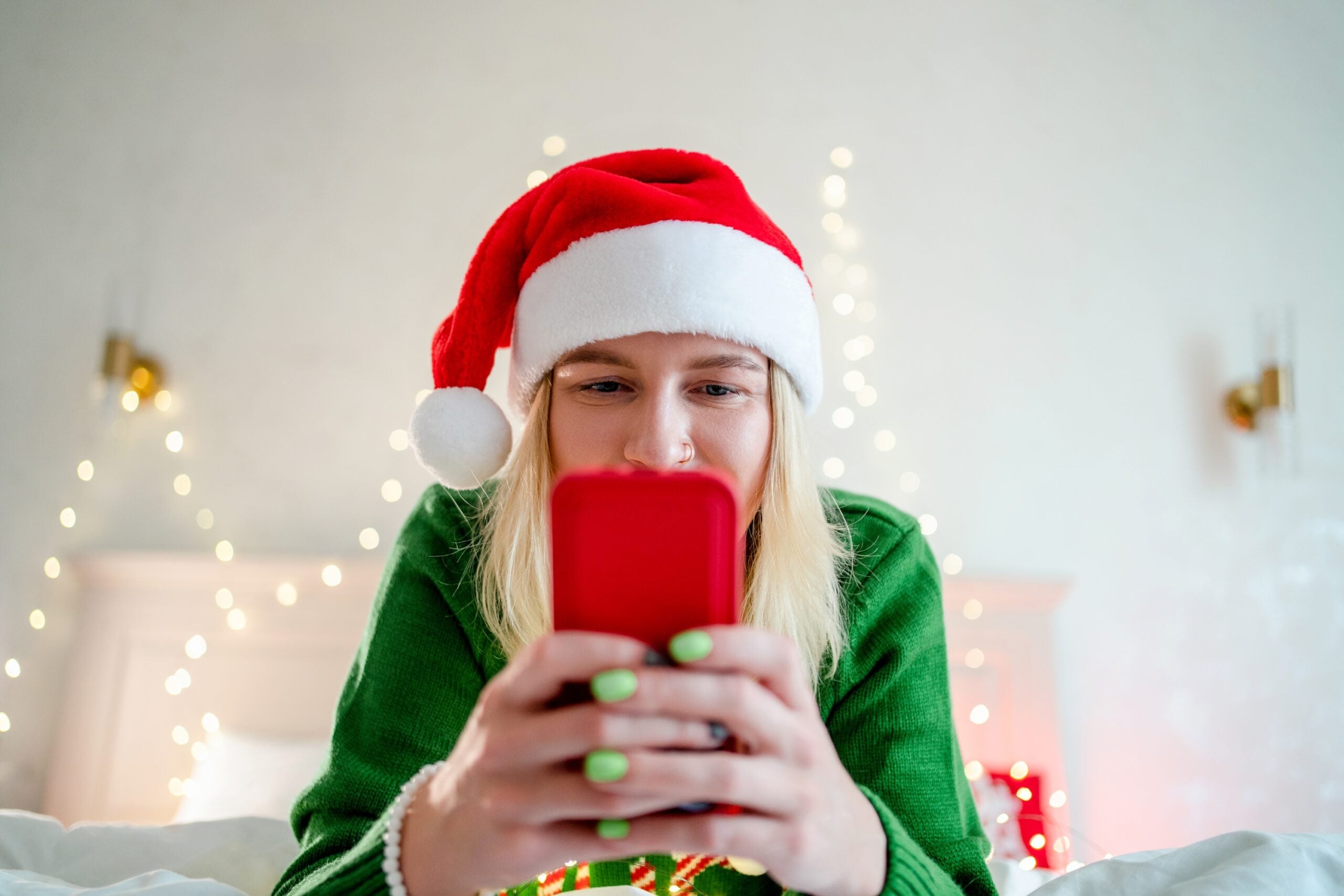 A woman shops on her phone.