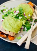 Sweet potato burrito smothered with avocado salsa verde