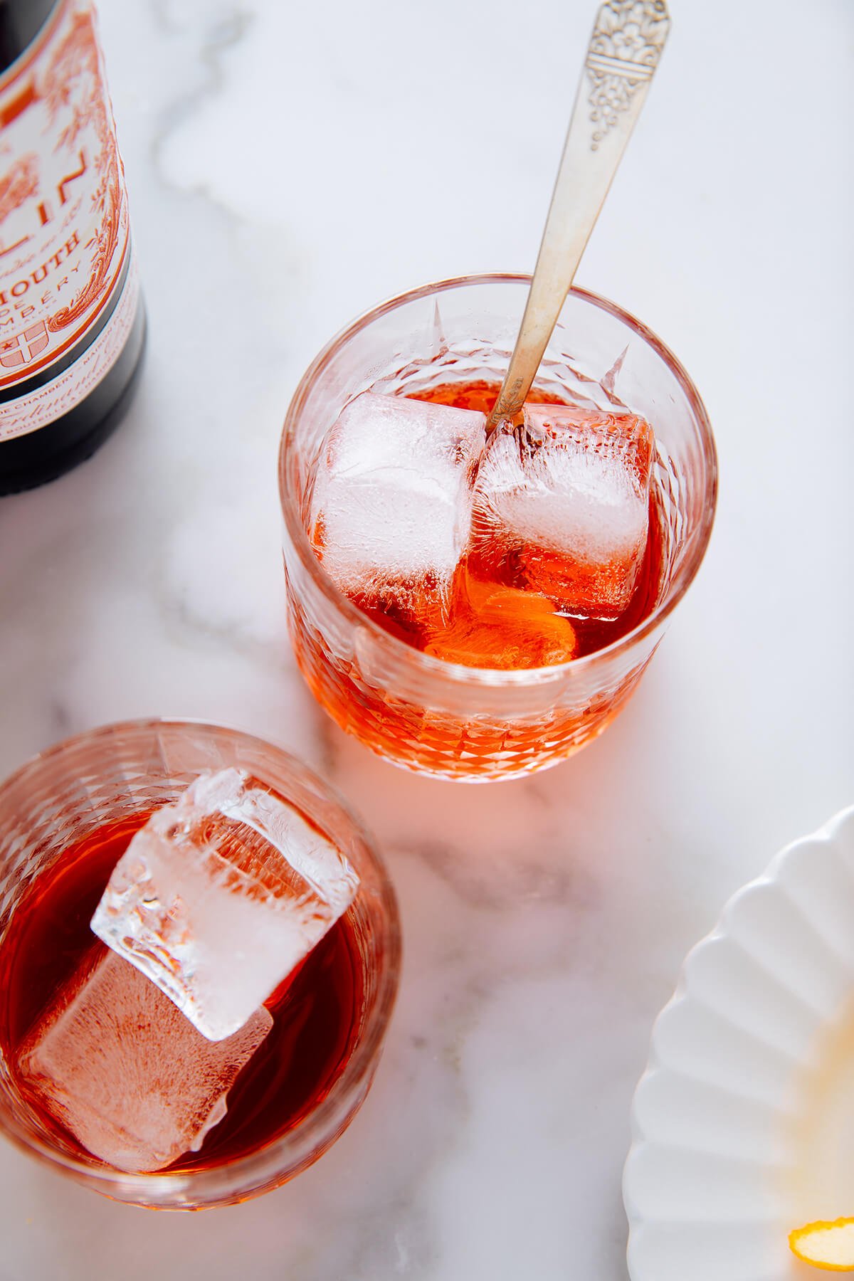 stirring Campari and sweet vermouth